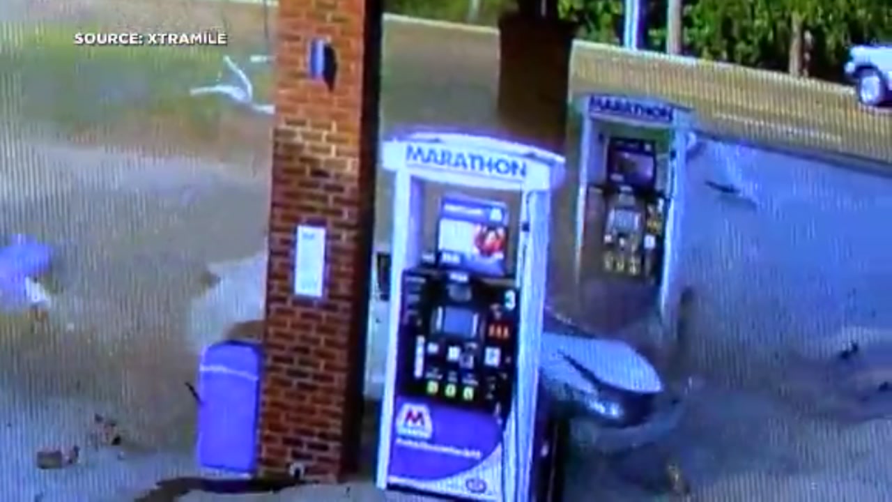 Car goes airborne and slams into gas station