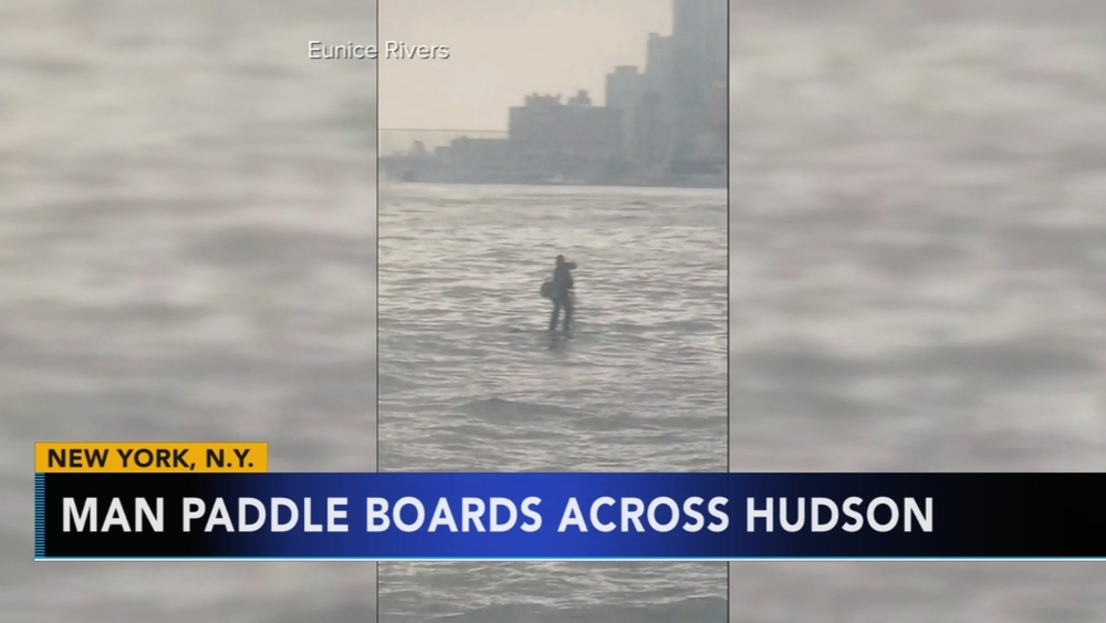 Man paddle boards across Hudson