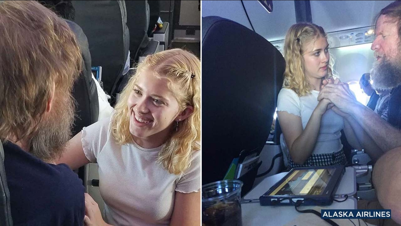 California teen Clara Daly helps a fellow passenger by using sign language during an Alaska Airlines flight.
