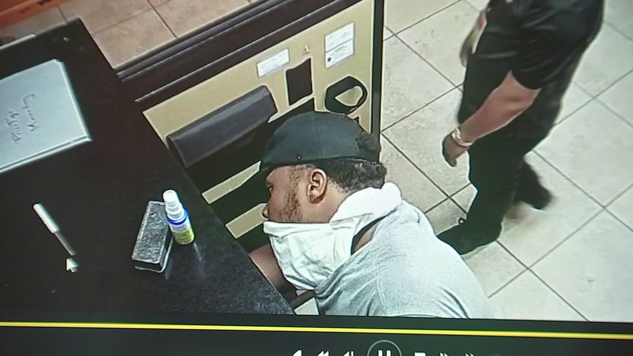 Boost Mobile store worker grabbed by the neck by robber