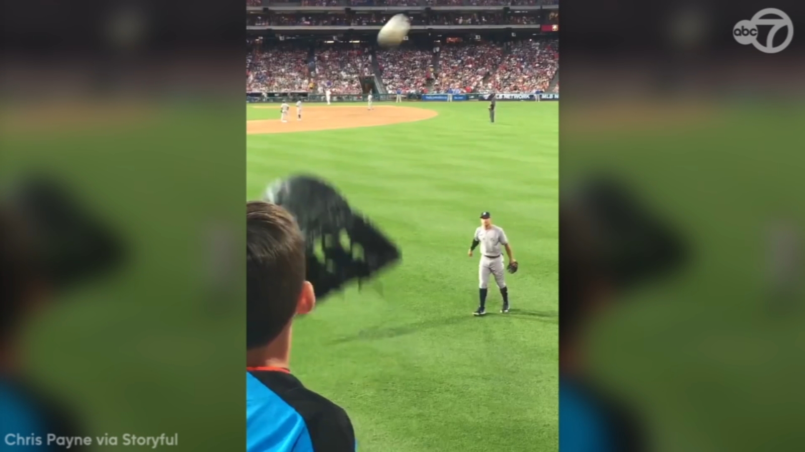 Aaron Judge plays catch with young baseball fan during Yankees game in