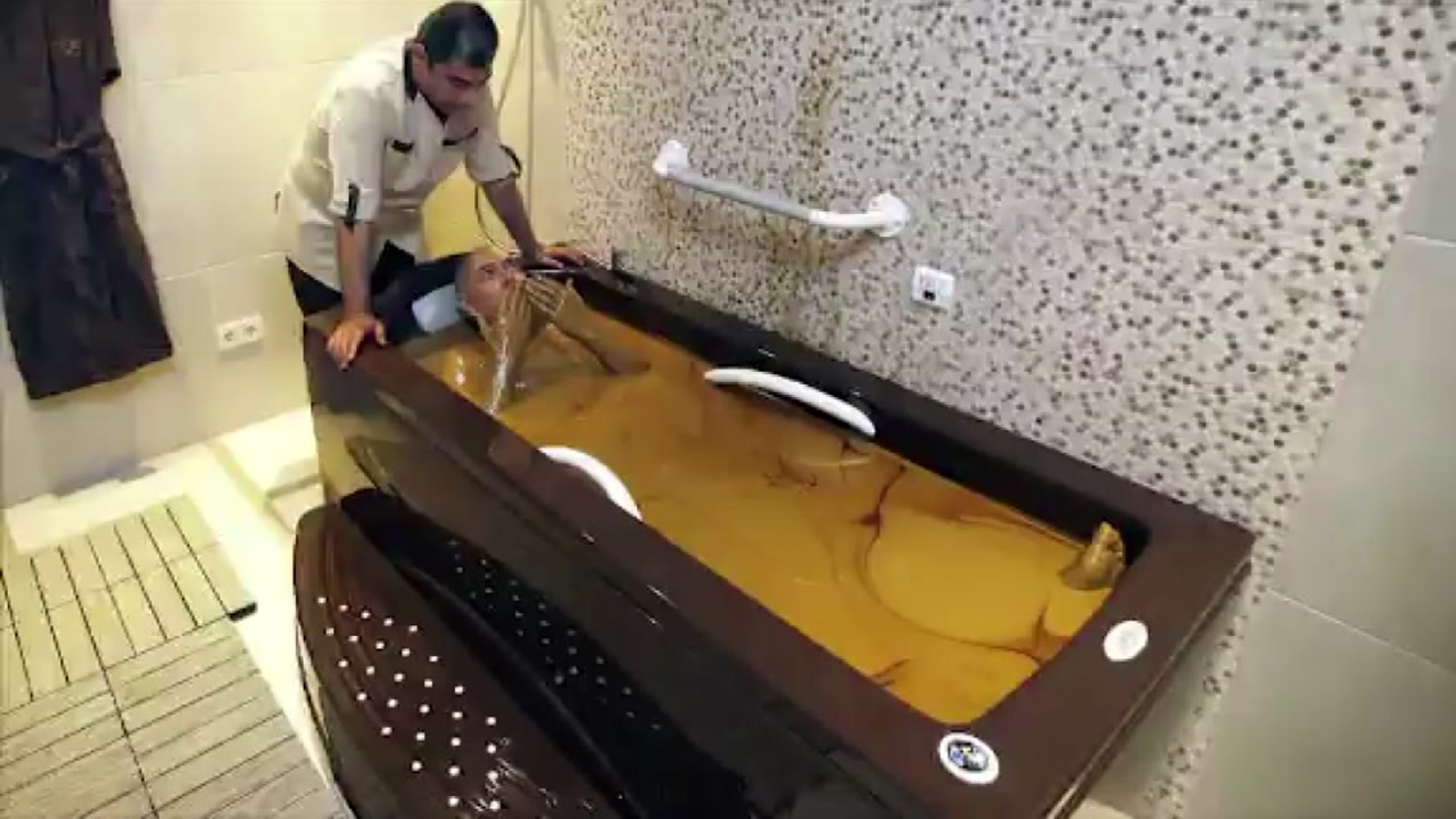 Resort guests bathe in crude oil reputed to have medicinal properties