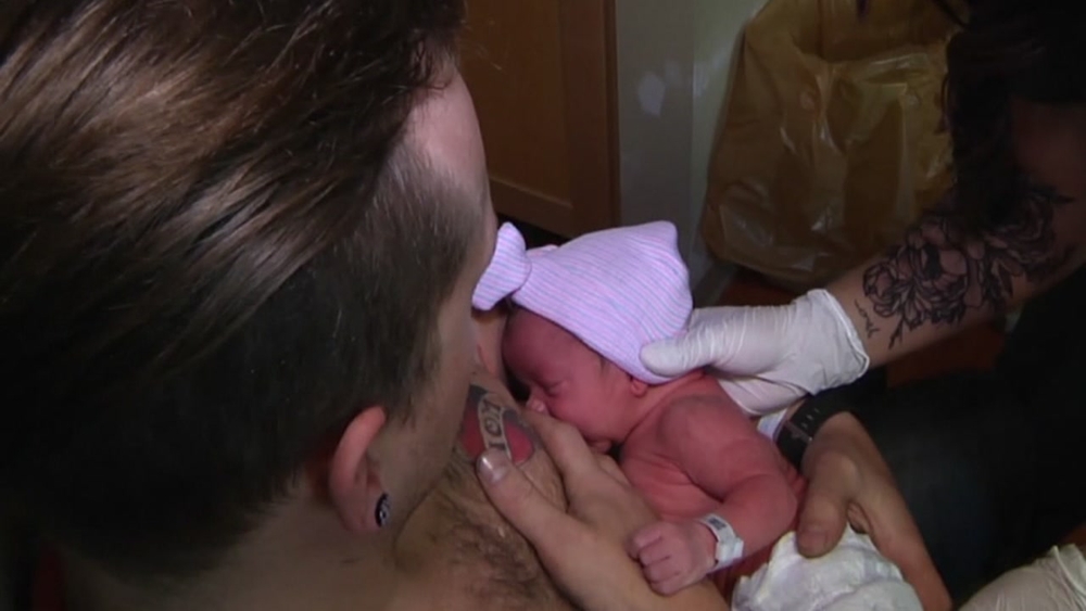 Dad helps out to 'breastfeed' newborn