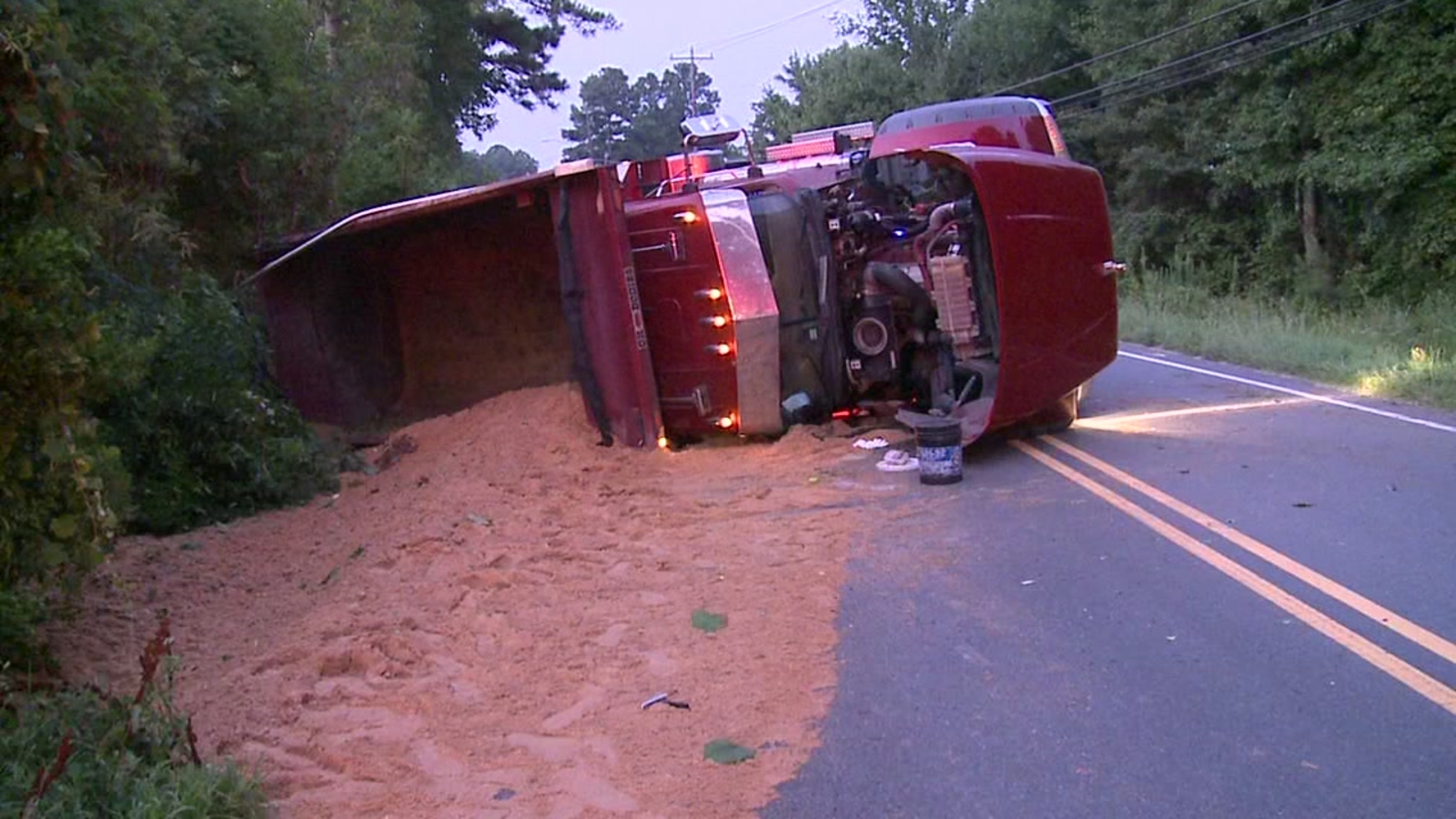 Man injured after dump truck overturns, spills load in Durham - ABC11 ...