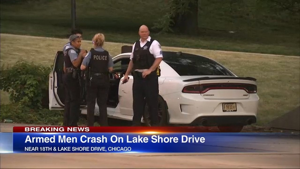 Police: Men pose with guns, crash car going wrong way on LSD; suspects at large