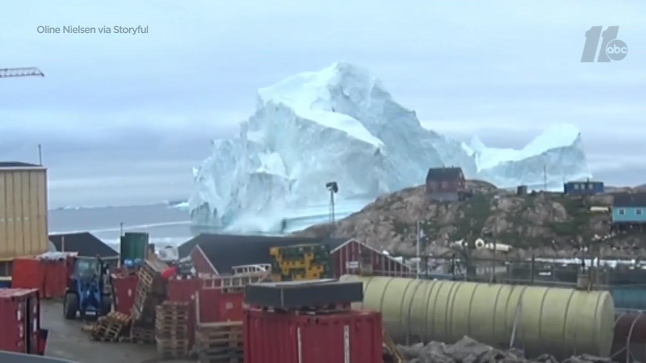 Watch: 300-foot iceberg floats near Greenland village