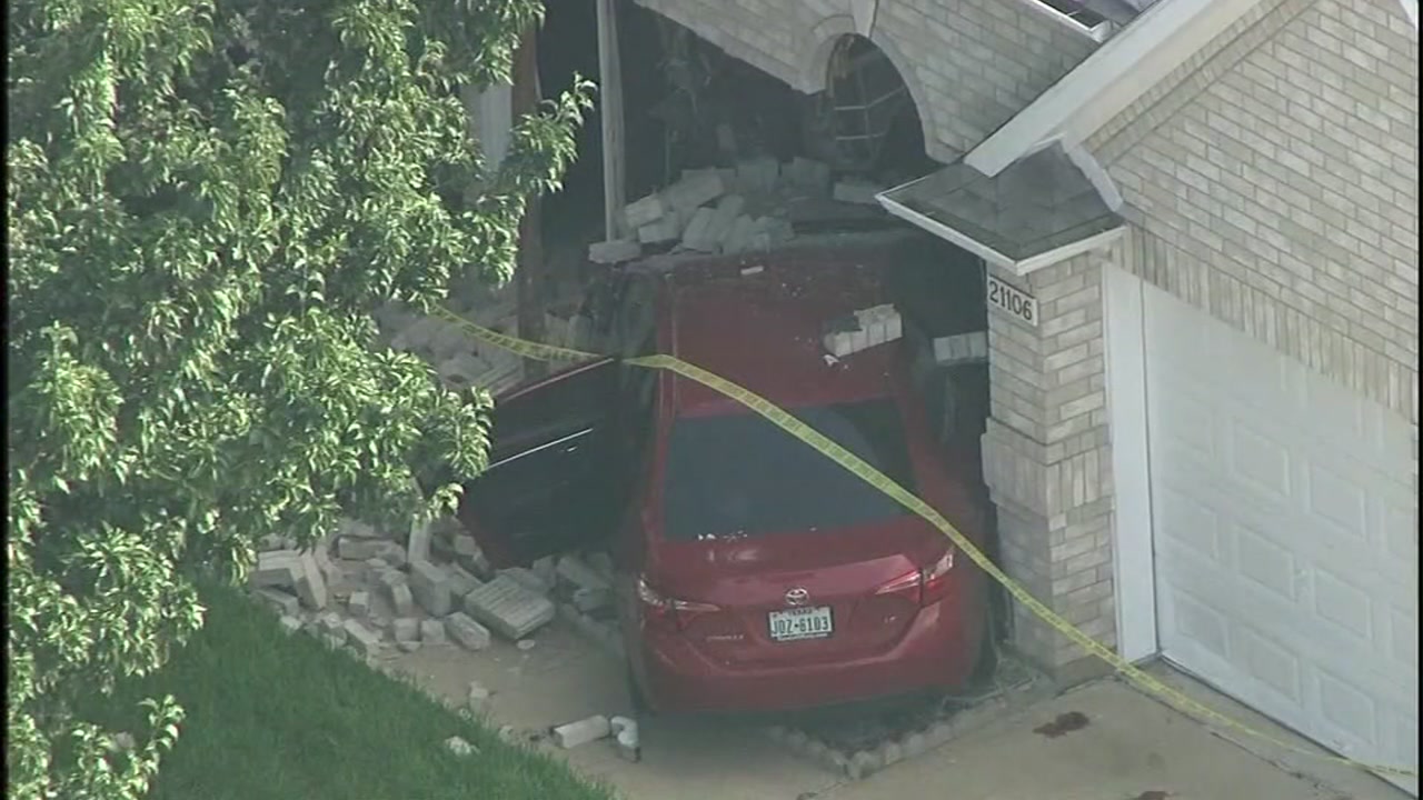 Driver hits woman with baby in stroller before hitting house