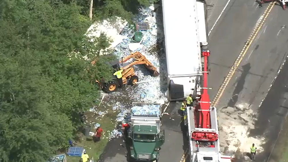 Truck carrying water bottles overturns in N.J.