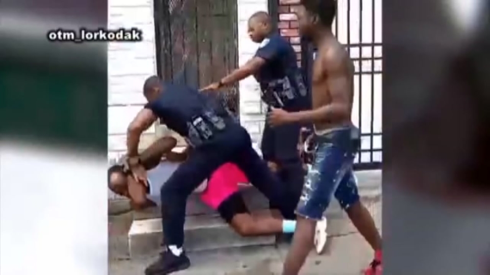 Officer suspended after video shows him punching man