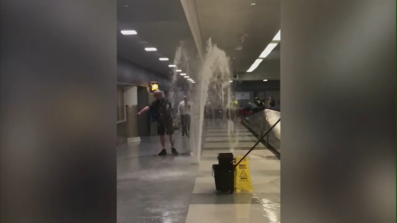 Geyser spews from the ground inside JFK Airport baggage claim