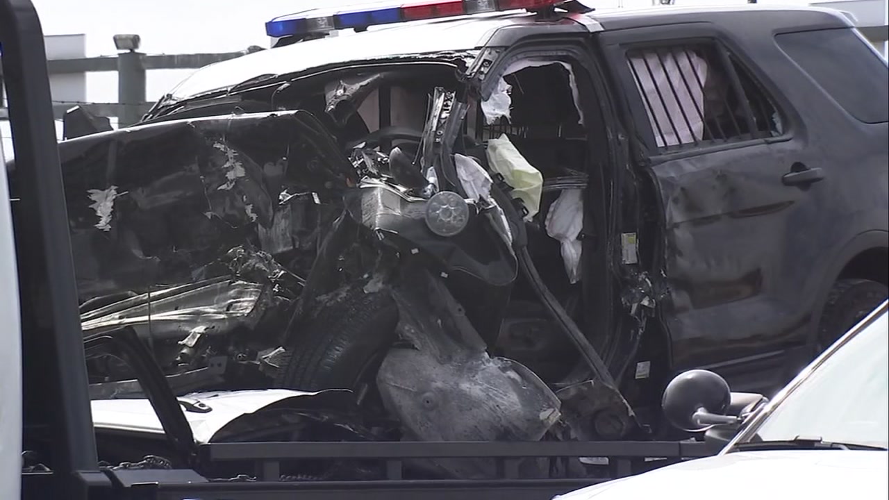 Oakland police officer pinned in semi-crash critically injured