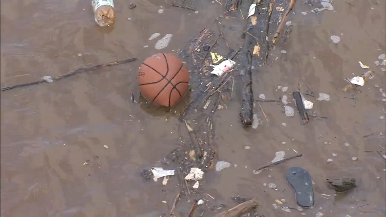 Debris, bottles, basketball flow down Schuylkill