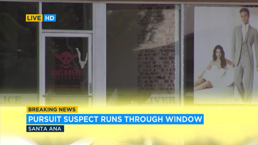 Pursuit suspect runs through window of Santa Ana store