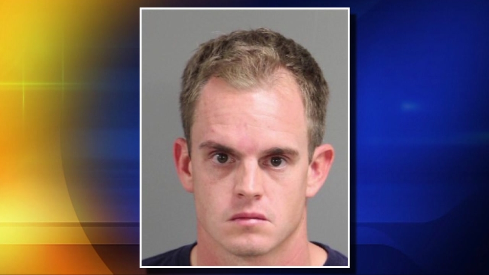 Swim Coach Charged
