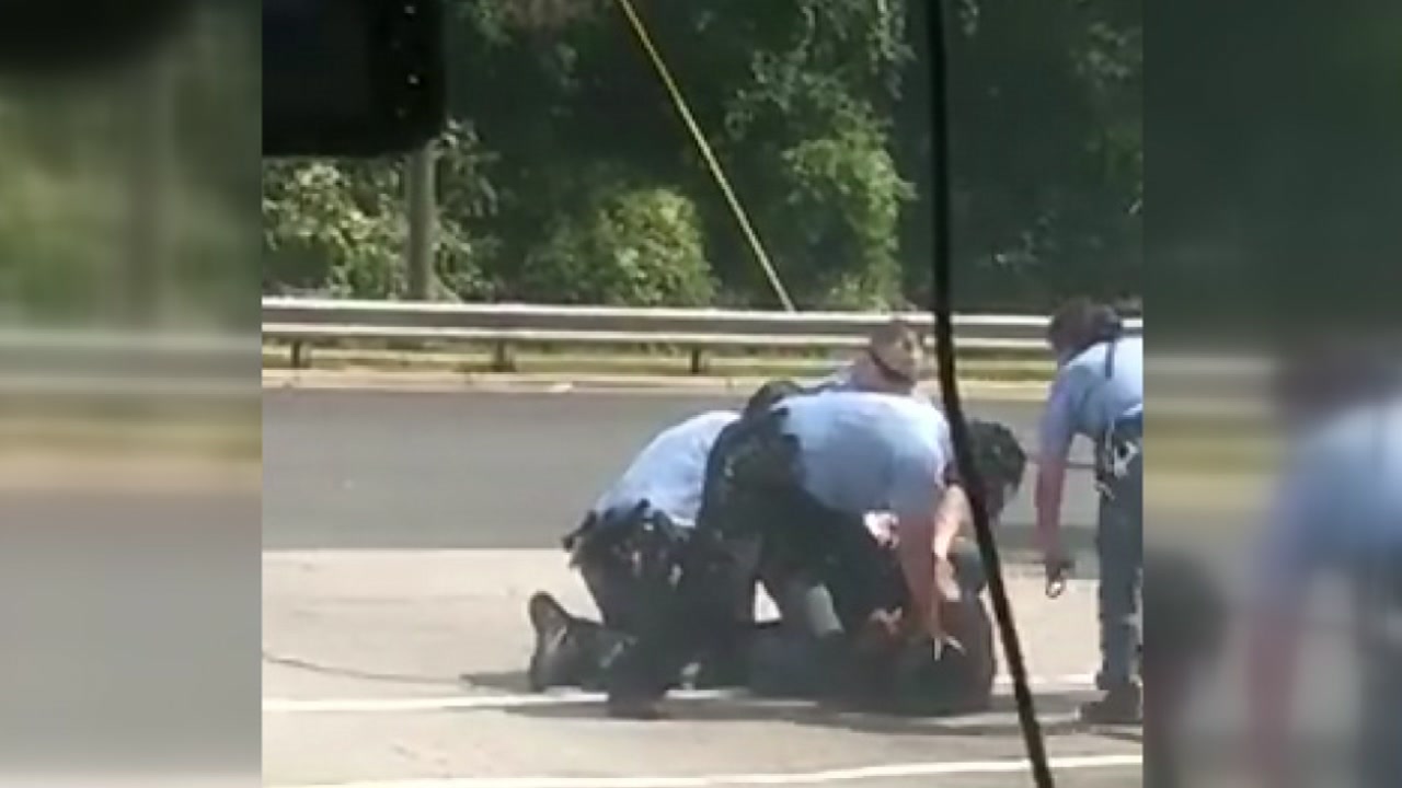 Cell phone video shows officers subduing man