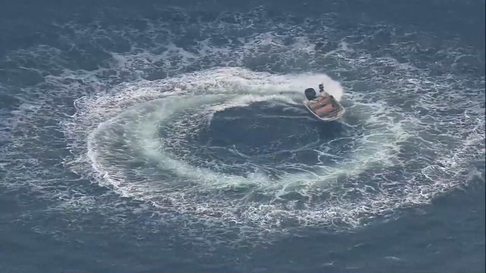 Coast Guard stops abandoned boat from spinning in circles in water