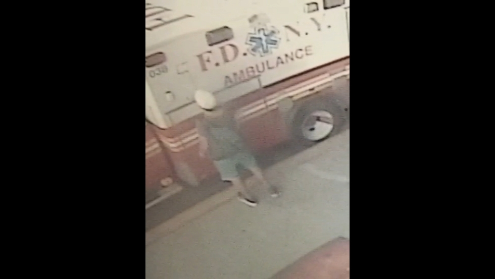 Surveillance video of suspect wanted for vandalizing ambulances