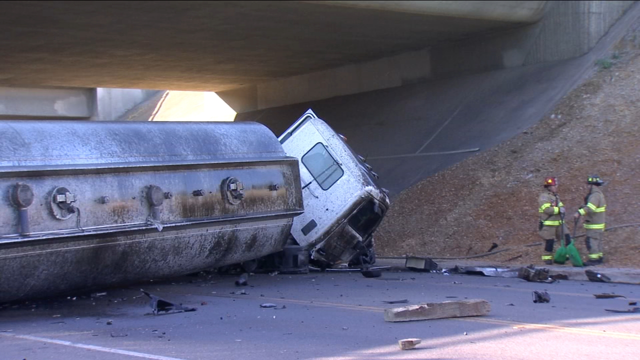 Big rig tanker truck careens off Highway 41 in Downtown Fresno and lands on Van Ness
