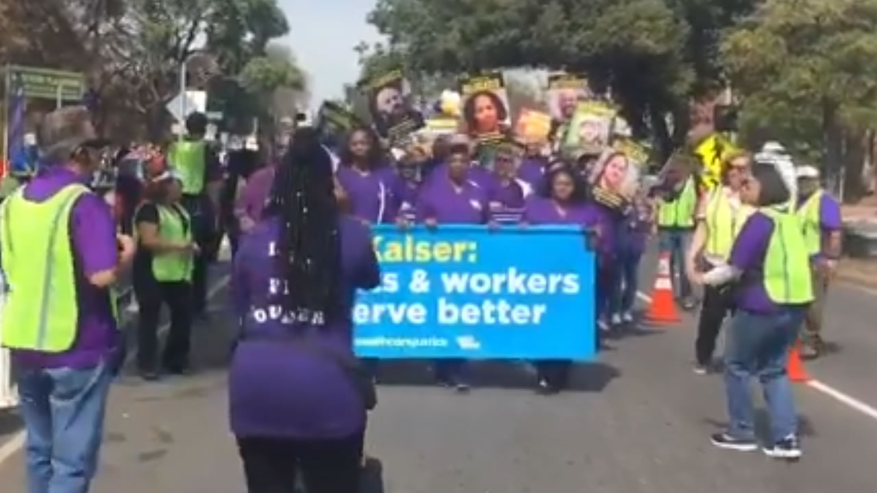 Kaiser workers protest job cuts hold march, rally in Oakland