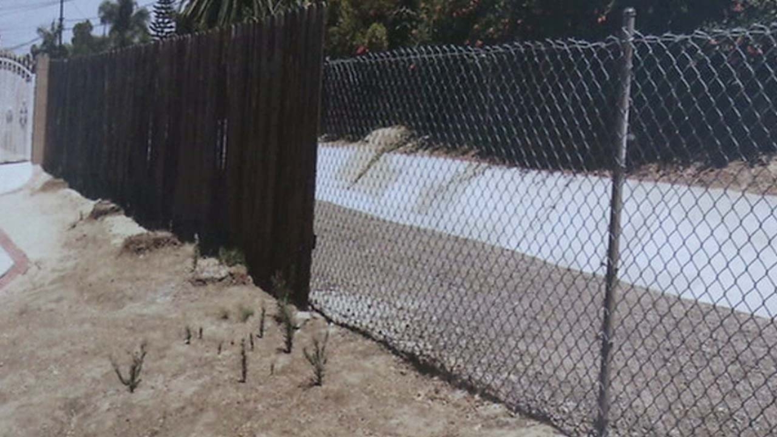 Orange County to use fences to keep homeless out of flood control