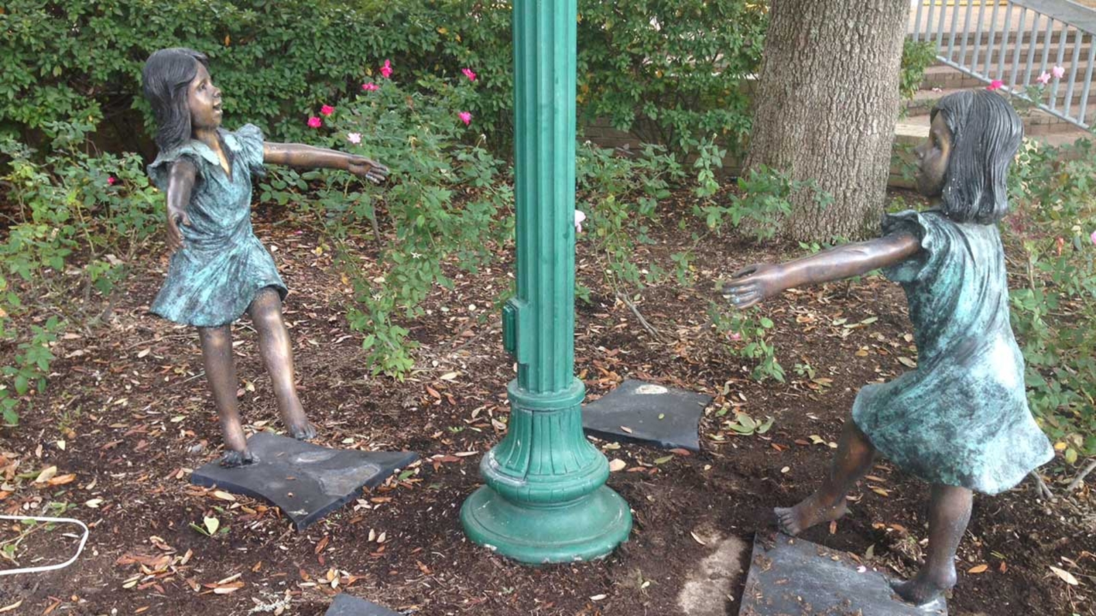 Who vandalized statues dedicated to abused and neglected children