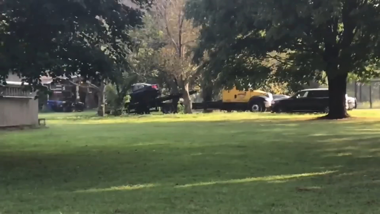 BMW towed away as search warranted executed at home of GoFundMe couple