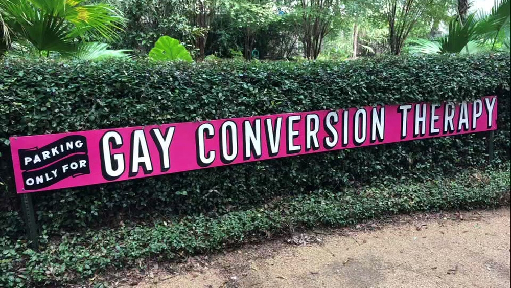 "Gay conversion therapy" parking sign put up to discourage churchgoers from parking