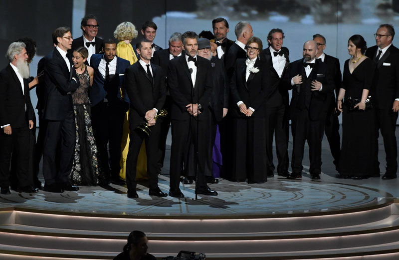 David Benioff and the cast and crew of "Game of Thrones" accept the award for outstanding drama series at the 70th Primetime Emmy Awards.