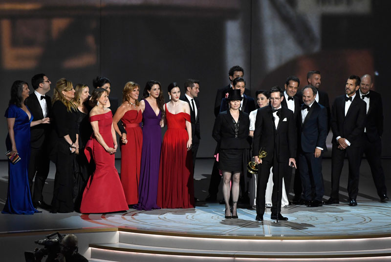 Daniel Palladino and the cast and crew of "The Marvelous Mrs. Maisel" accept the award for outstanding comedy series at the 70th Primetime Emmy Awards.