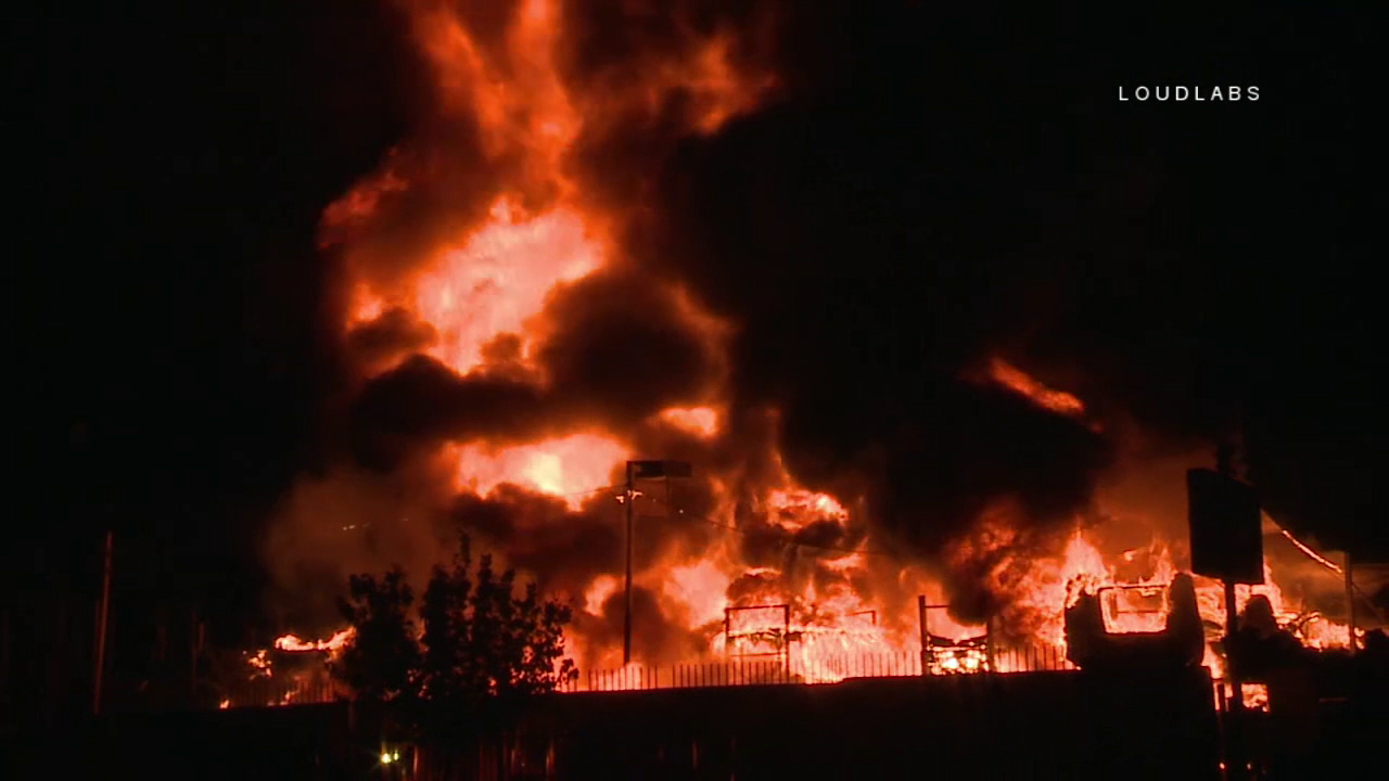 Firefighters extinguish dramatic blaze at Sun Valley auto parts yard