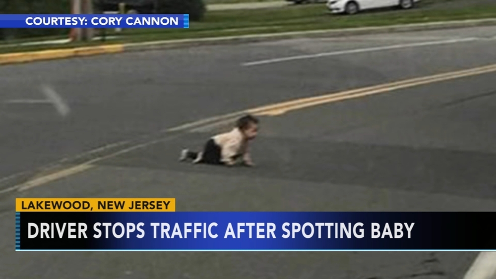 Driver stops traffic after spotting baby in road