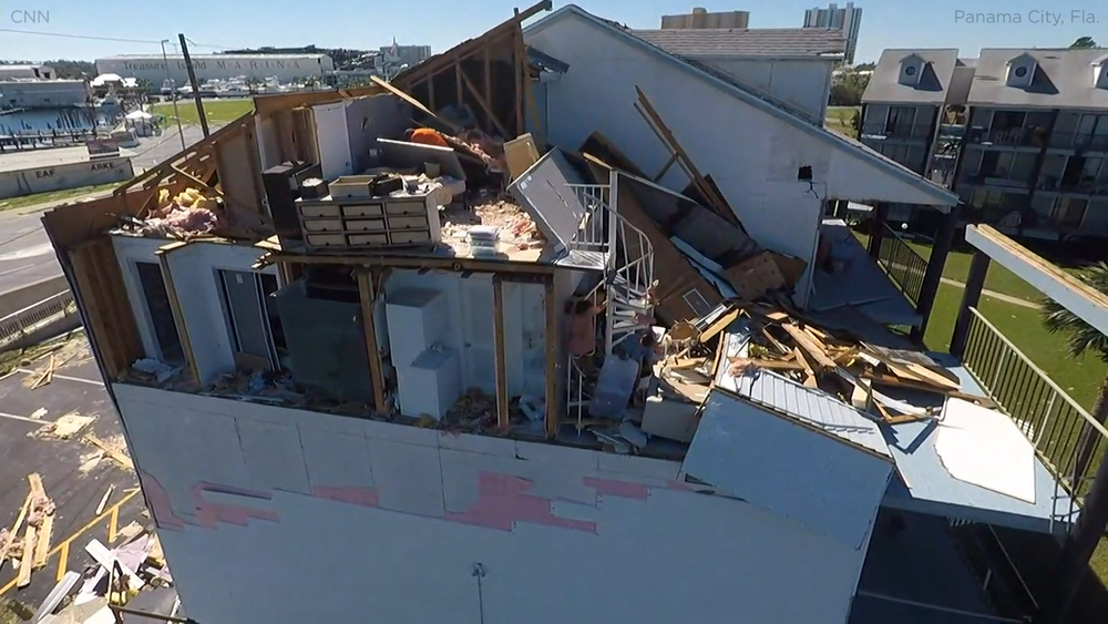 Family sifts through wreckage from home pummelled by Michael