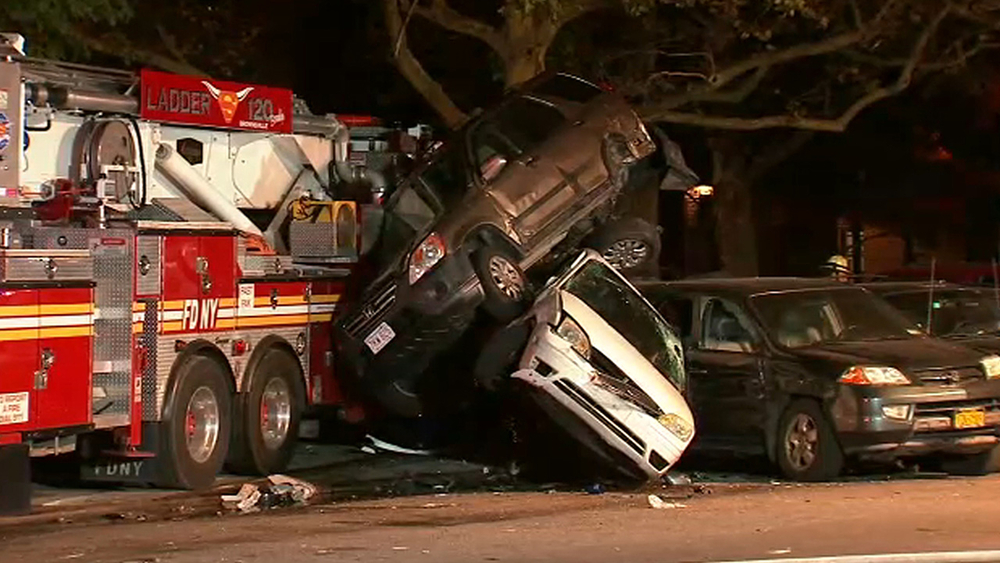 Firefighter hurt after crashing truck into parked cars