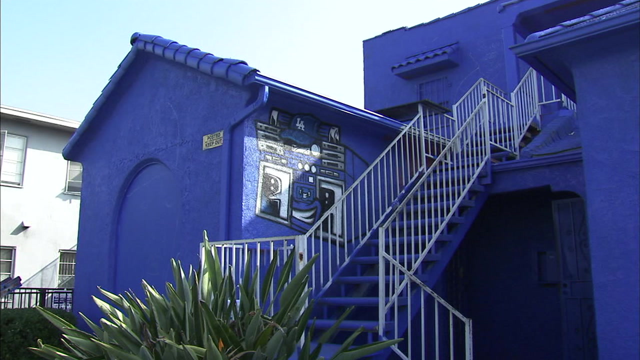 Street artist covers Mid-City house with Dodger Blue