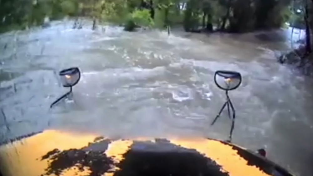 Video shows school bus swept away by floodwaters