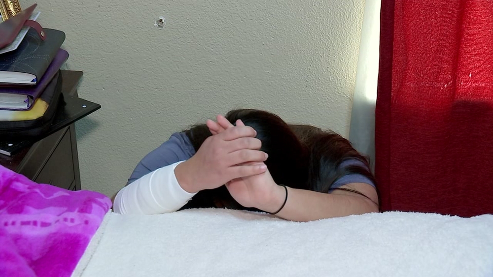 A 17-year old girl was grazed by a bullet while praying on her bed.