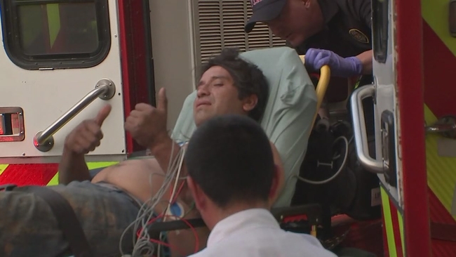 Worker rescued after getting trapped in trench collapse beneath ...