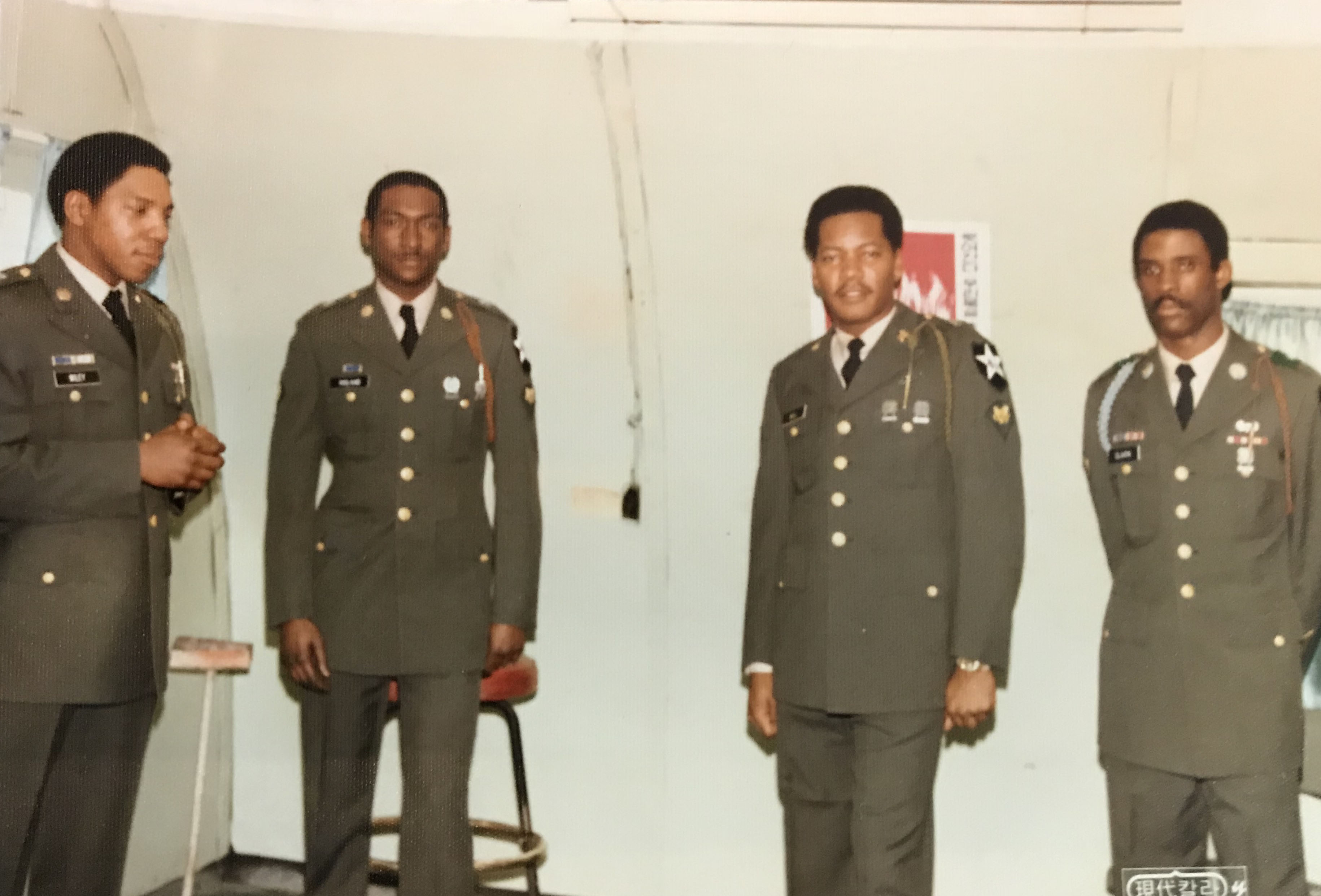 Kenneth Bell with fellow servicemen at a promotion ceremony