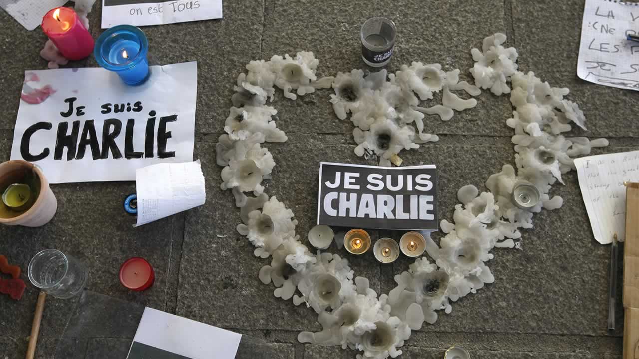 Search continues for gunmen as French mourn victims