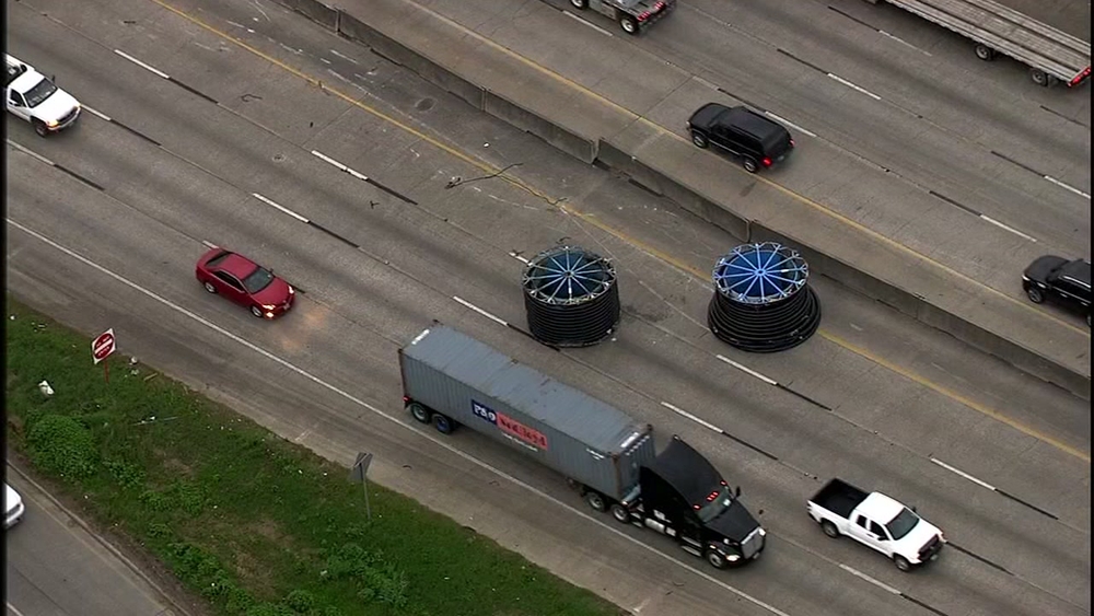 Driver cited after large spools roll off truck, sending people swerving on East Freeway