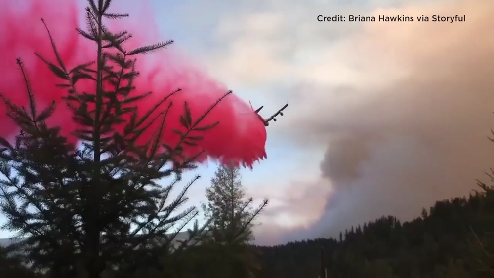 Tanker aircraft battling Camp Fire drops fire retardant over Butte Co.