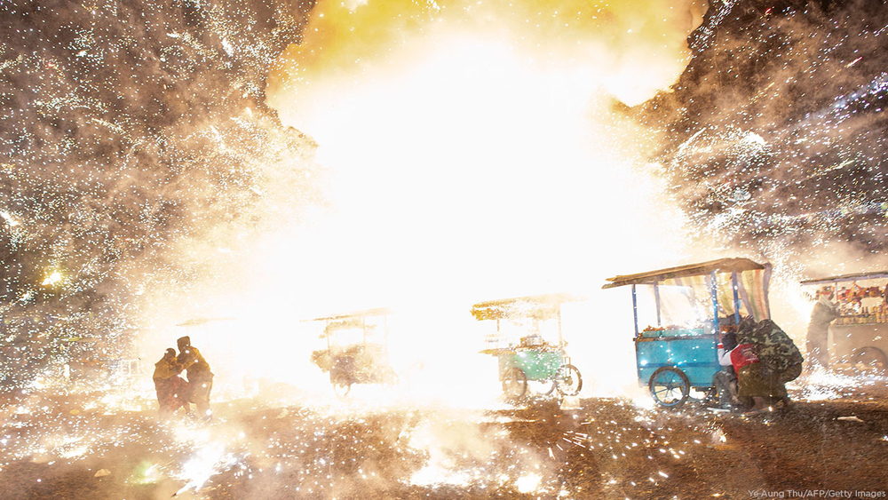 Hot air balloon full of fireworks explodes over festival
