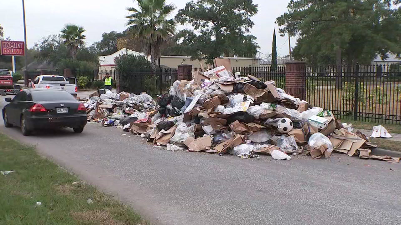 Spilled load of trash after garbage truck fire