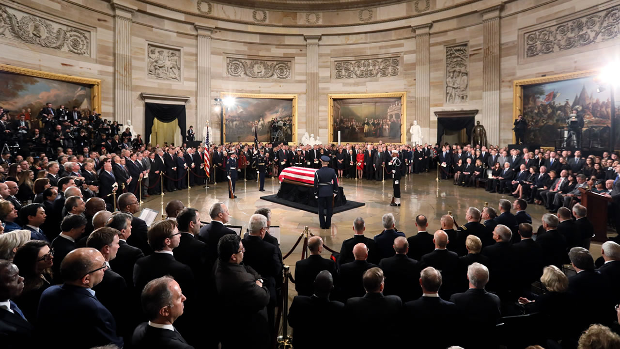 President George HW Bush's flag-draped casket arrives at Capitol