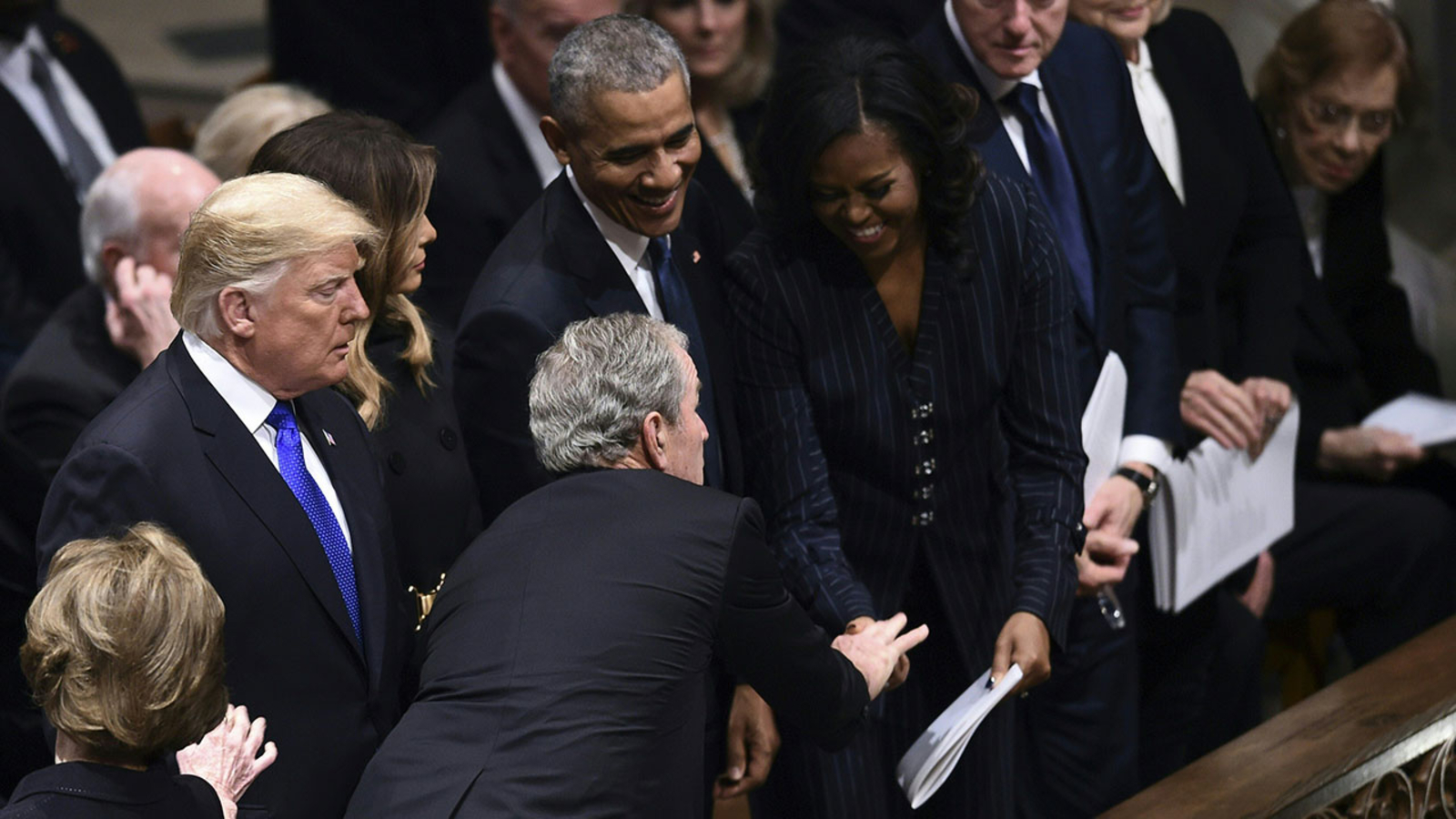 Video George W Bush Appears To Sneak Michelle Obama Candy At George Hw Bush S Funeral Abc30 Fresno