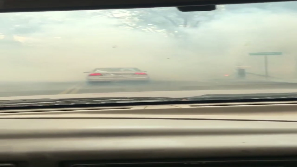 VIDEO: Resident of Paradise battles high winds as he flees fire