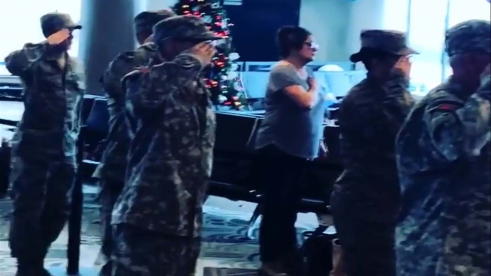 Airport stops, sings national anthem for children of fallen troops
