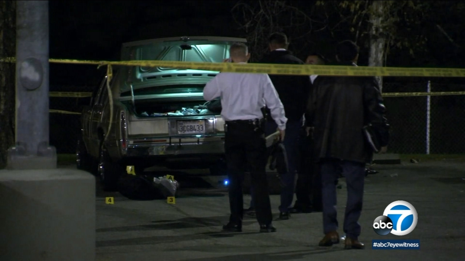 Man killed after 2 suspects open fire while he changes tire in North ...