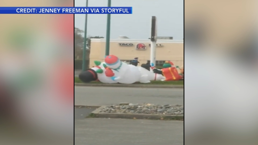 Inflatable snowmen battle in windy Oregon