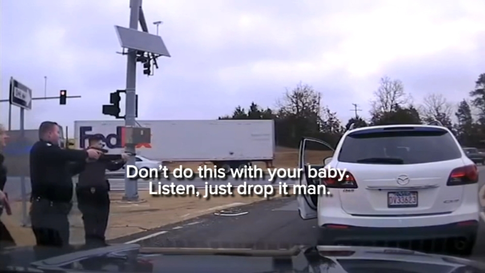 Police standoff: 'Don't do this with your baby - just drop it man'